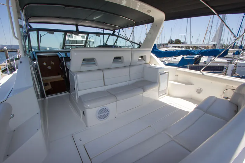 Sparrow Yacht Photos Pics 1995 Tiara Yachts 4000 Express interior with white seating and marina view.