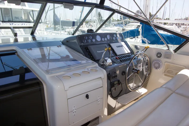 Sparrow Yacht Photos Pics 1995 Tiara Yachts 4000 Express helm with modern controls and navigation equipment.