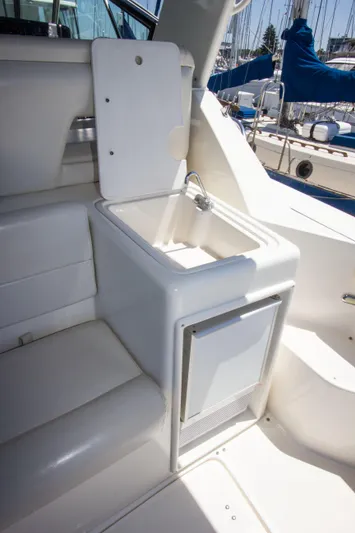 Sparrow Yacht Photos Pics 1995 Tiara Yachts 4000 Express boat interior with sink and seating area.