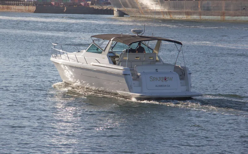 Sparrow Yacht Photos Pics 1995 Tiara Yachts 4000 Express cruising on calm waters.