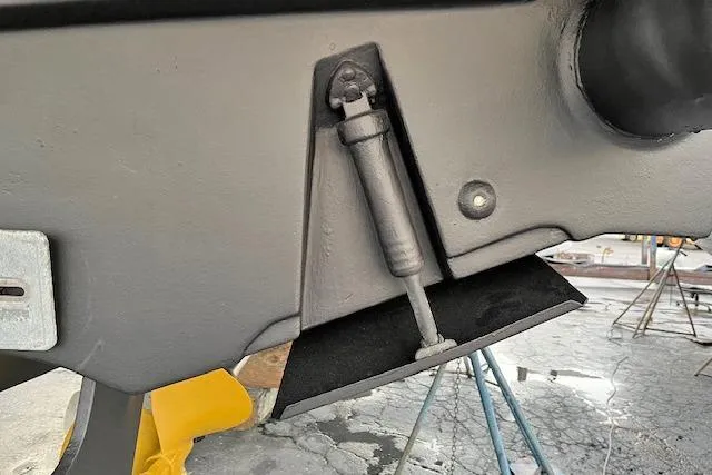 Sparrow Yacht Photos Pics 1995 Tiara Yachts 4000 Express trim tab detail in a boatyard setting.