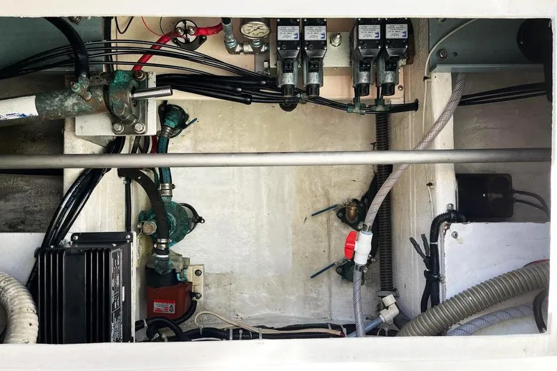 Sparrow Yacht Photos Pics Engine compartment of a 1995 Tiara Yachts 4000 Express, showcasing mechanical components and wiring.