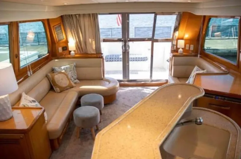 Prudence Yacht Photos Pics Luxurious interior of 2005 McKinna 57 Pilothouse yacht with elegant seating and modern design.