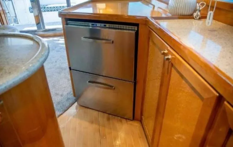 Prudence Yacht Photos Pics 2005 McKinna 57 Pilothouse interior with stainless steel drawers and wooden cabinetry.