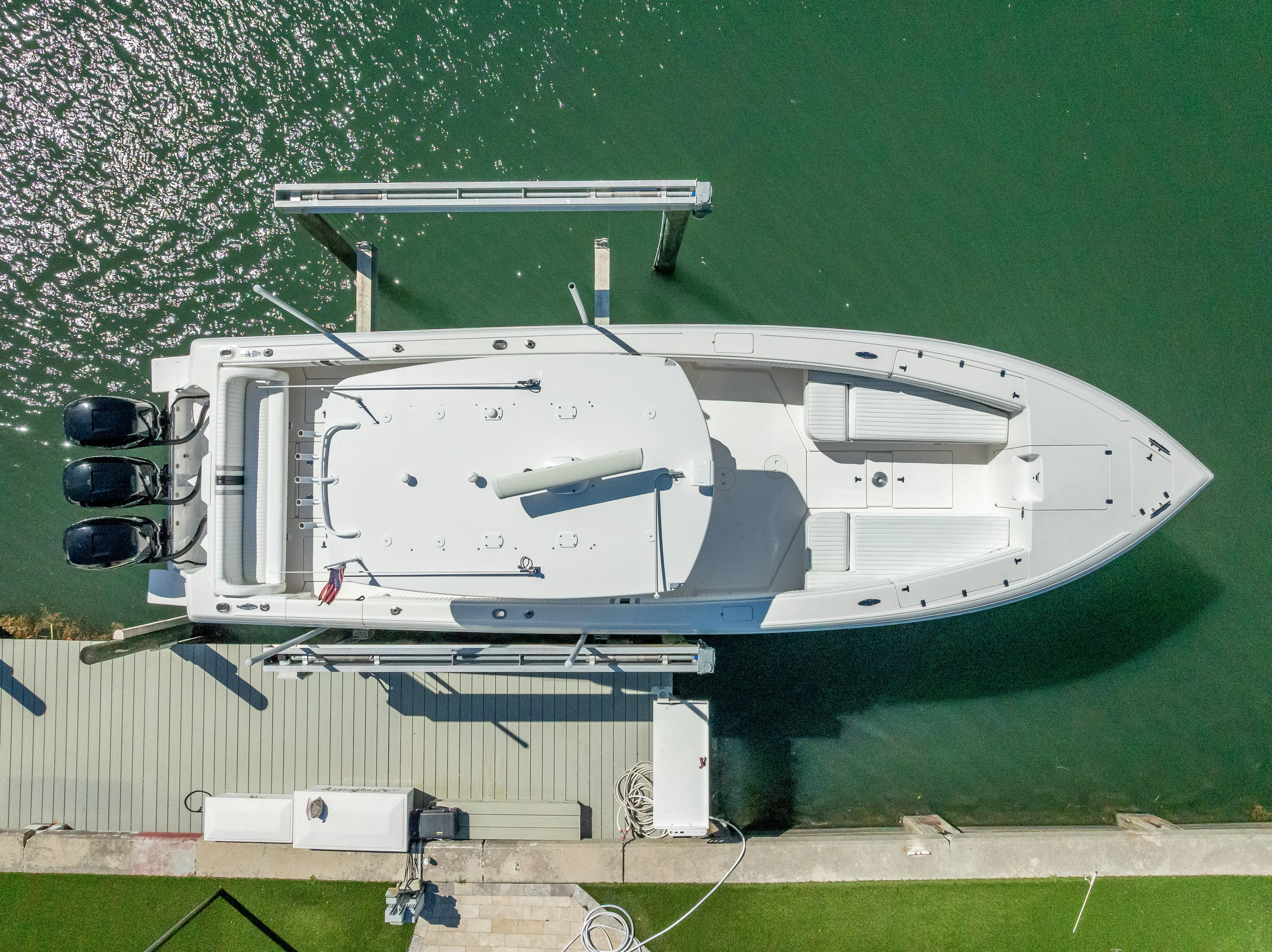  Yacht Photos Pics Aerial view of a 2010 Intrepid 370 Open boat docked in clear water.