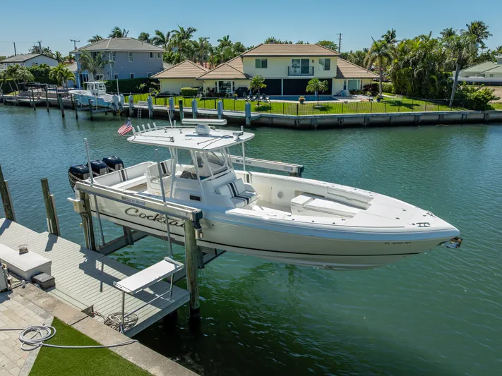  Yacht Photos Pics 2010 Intrepid 370 Open boat docked in a scenic waterfront setting.