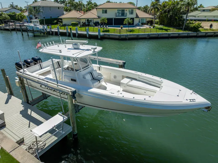  Yacht Photos Pics 2010 Intrepid 370 Open boat docked on a sunny waterfront.