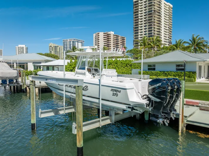  Yacht Photos Pics 2010 Intrepid 370 Open boat docked with cityscape background.