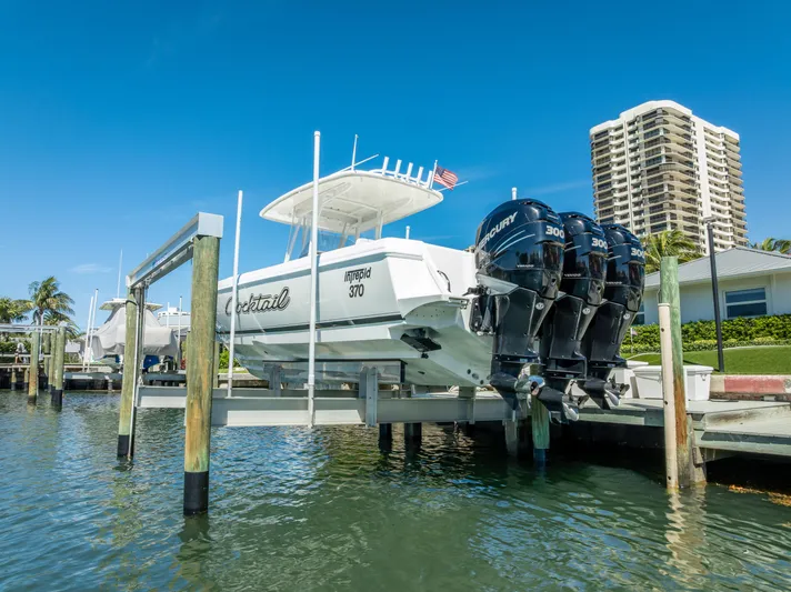  Yacht Photos Pics 2010 Intrepid 370 Open boat docked with triple outboard engines.