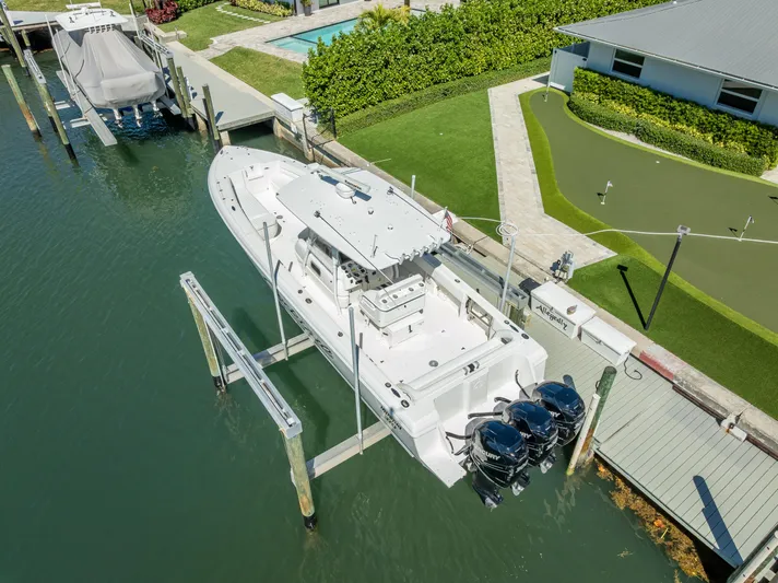  Yacht Photos Pics Intrepid 370 Open 2010 boat docked with triple outboard engines, aerial view.