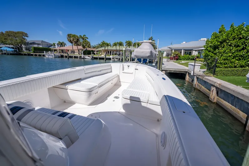  Yacht Photos Pics 2010 Intrepid 370 Open boat docked in a scenic waterfront setting.