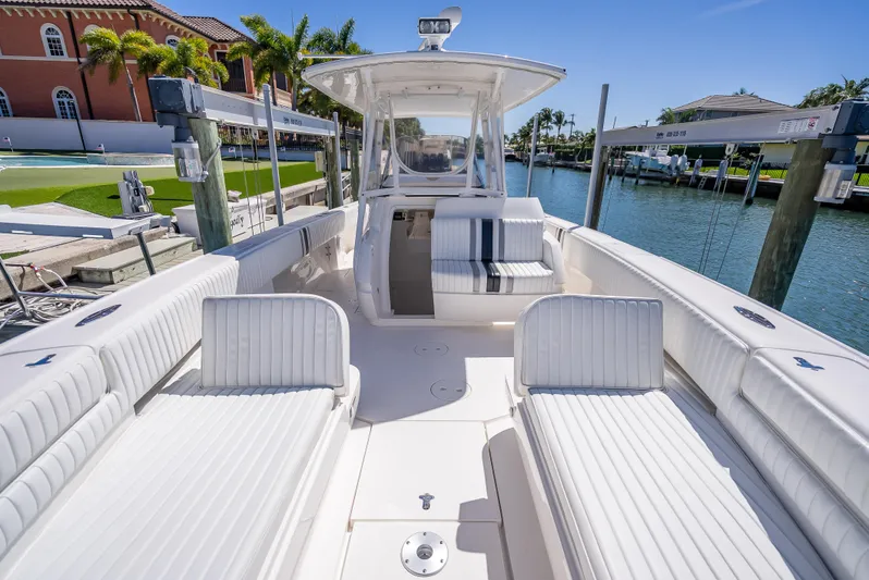  Yacht Photos Pics 2010 Intrepid 370 Open boat docked, featuring spacious seating and sleek design.