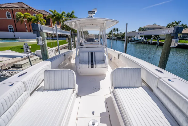  Yacht Photos Pics 2010 Intrepid 370 Open boat docked in sunny marina, featuring spacious seating and sleek design.