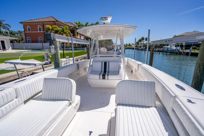  Yacht Photos Pics 2010 Intrepid 370 Open boat docked, featuring spacious white seating and sleek design.