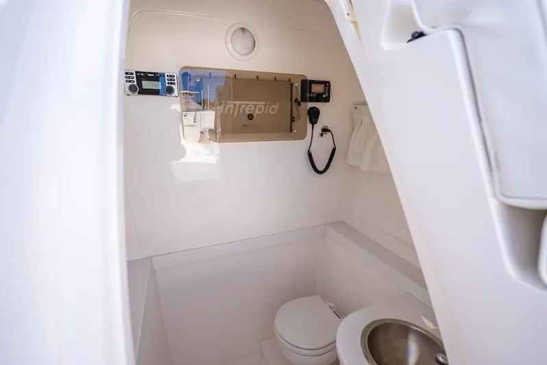  Yacht Photos Pics 2010 Intrepid 370 Open boat interior with toilet and control panel.