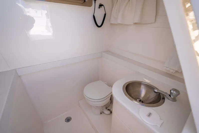  Yacht Photos Pics 2010 Intrepid 370 Open boat bathroom with toilet and sink.