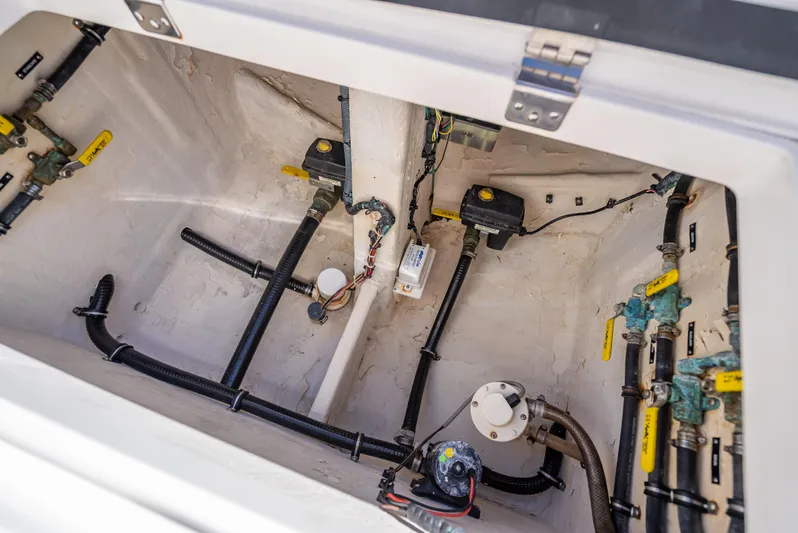  Yacht Photos Pics 2010 Intrepid 370 Open boat compartment with wiring and plumbing components.