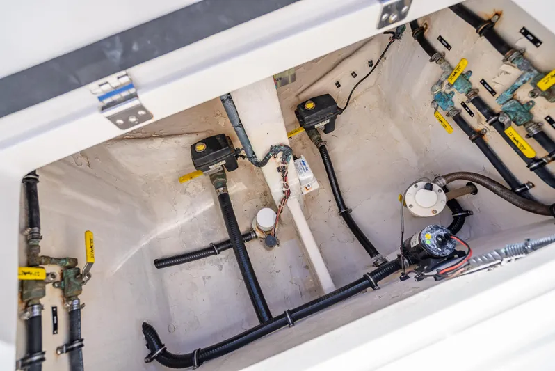  Yacht Photos Pics Intrepid 370 Open 2010 boat interior showing plumbing and wiring components.