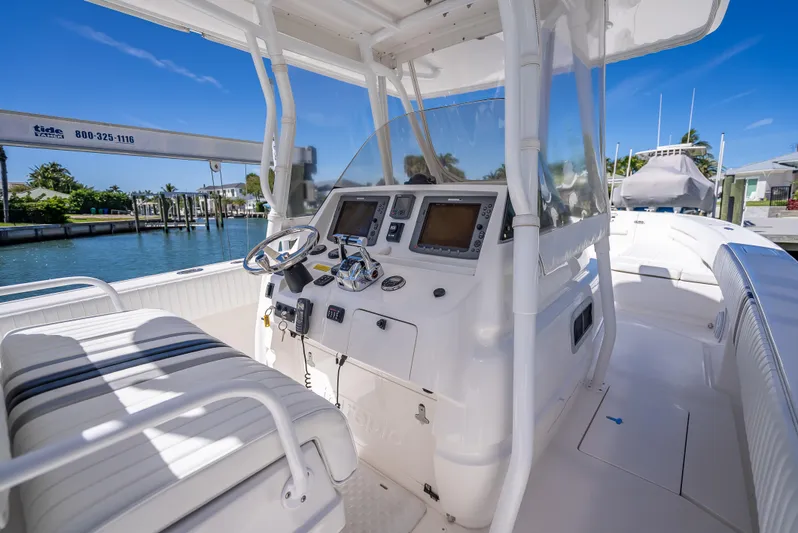  Yacht Photos Pics 2010 Intrepid 370 Open boat cockpit with dual steering wheels and navigation screens.