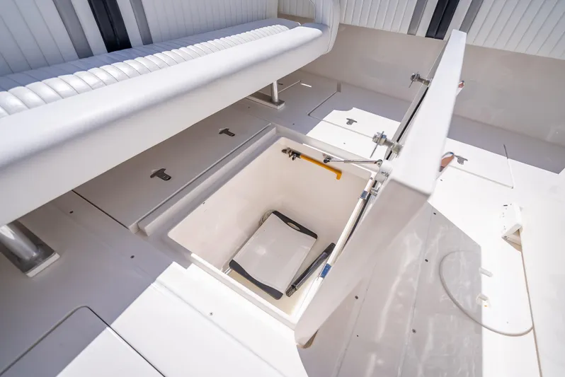  Yacht Photos Pics 2010 Intrepid 370 Open boat with open storage compartment and seating area.