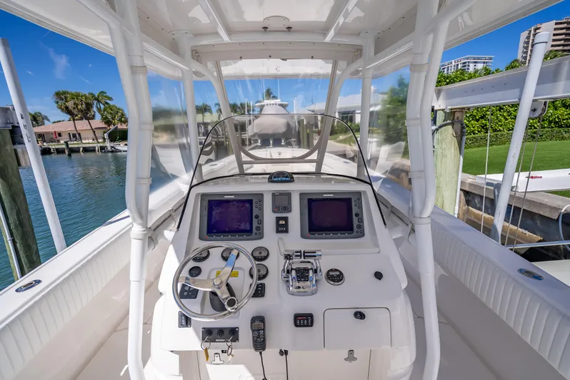  Yacht Photos Pics 2010 Intrepid 370 Open boat cockpit with navigation controls and steering wheel.