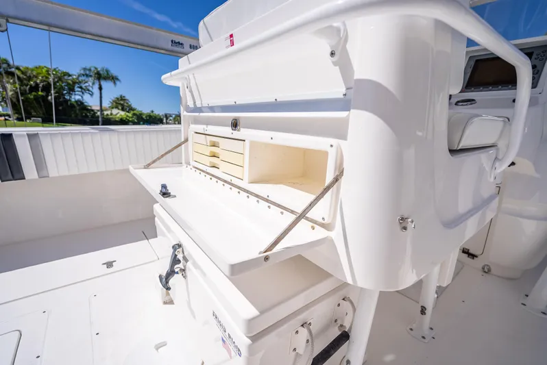  Yacht Photos Pics 2010 Intrepid 370 Open boat interior with storage compartments and white finish.
