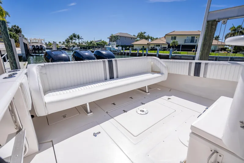  Yacht Photos Pics 2010 Intrepid 370 Open boat with spacious seating and sleek design at a marina.