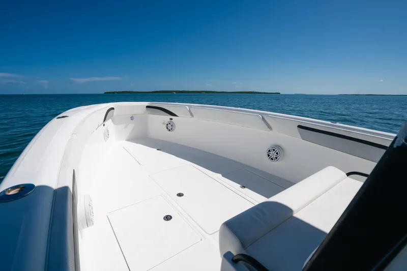  Yacht Photos Pics 2013 Deep Impact 33 boat on calm ocean, clear blue sky, spacious deck.