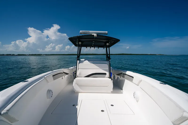  Yacht Photos Pics 2013 Deep Impact 33 boat on calm ocean with clear blue sky.