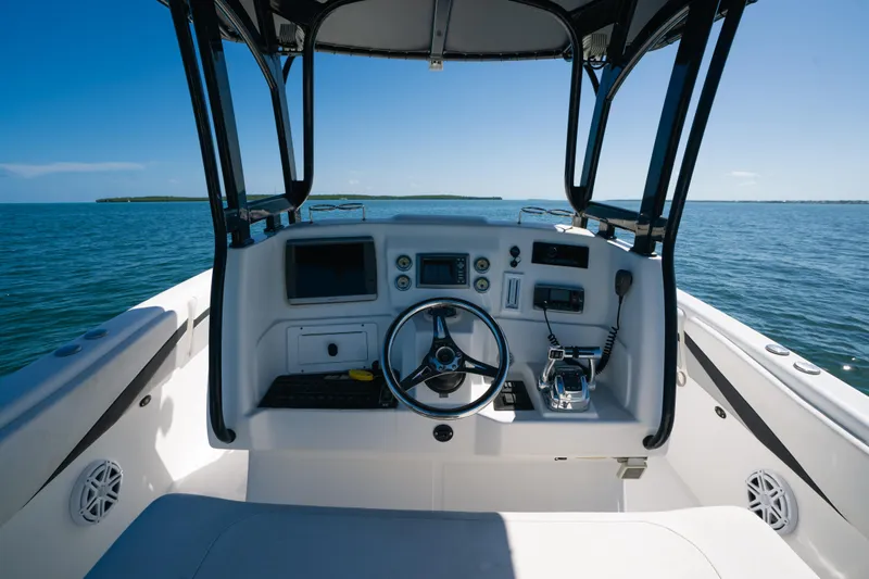 Yacht Photos Pics Cockpit view of 2013 Deep Impact 33 boat on open water.