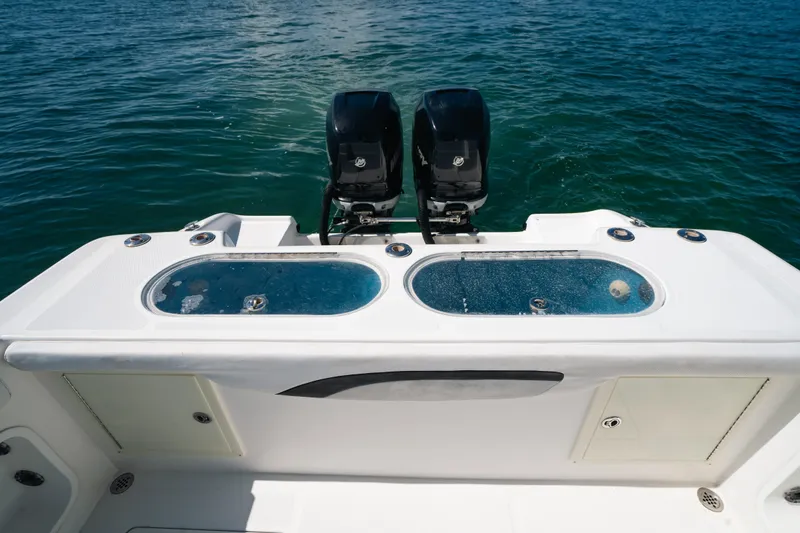  Yacht Photos Pics 2013 Deep Impact 33 boat with dual engines and live wells on open water.