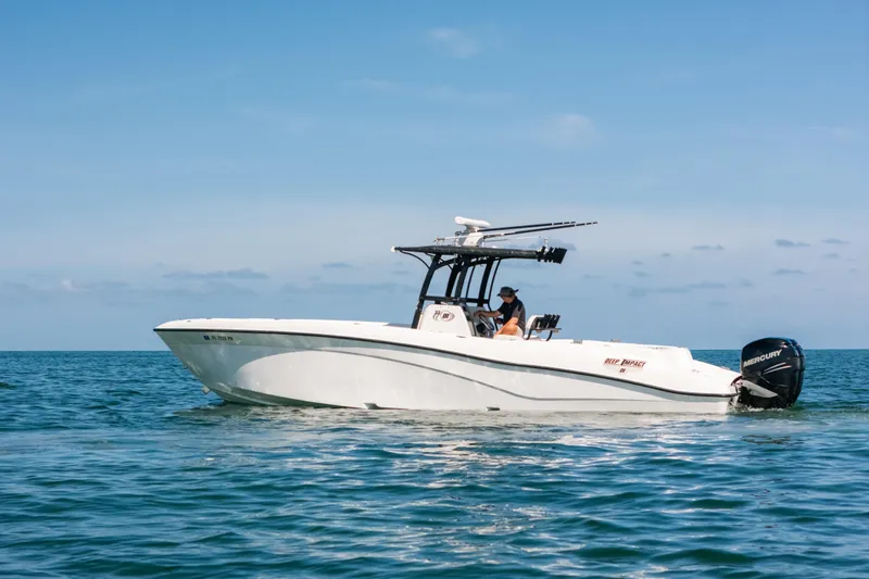  Yacht Photos Pics 2013 Deep Impact 33 boat cruising on open water under clear blue skies.