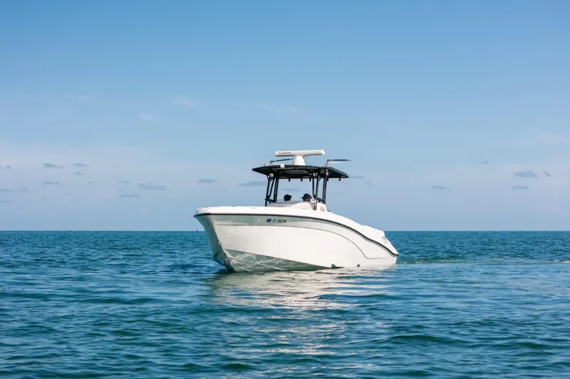  Yacht Photos Pics 2013 Deep Impact 33 boat cruising on calm ocean waters under clear blue sky.