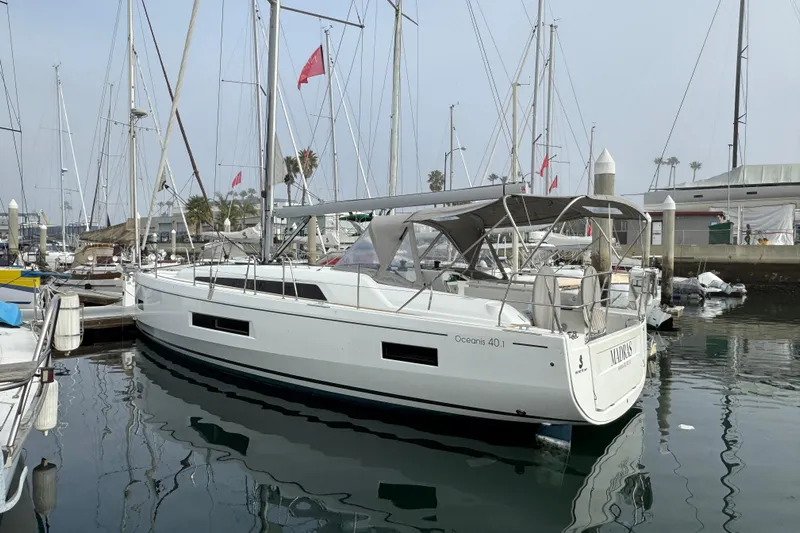 Madras Yacht Photos Pics 2022 Beneteau Oceanis 40.1 yacht docked in marina, calm water reflections.