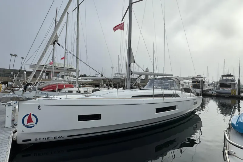 Madras Yacht Photos Pics 2022 Beneteau Oceanis 40.1 sailboat docked in marina, side view.