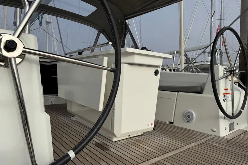 Madras Yacht Photos Pics 2022 Beneteau Oceanis 40.1 yacht cockpit with dual steering wheels and teak flooring.