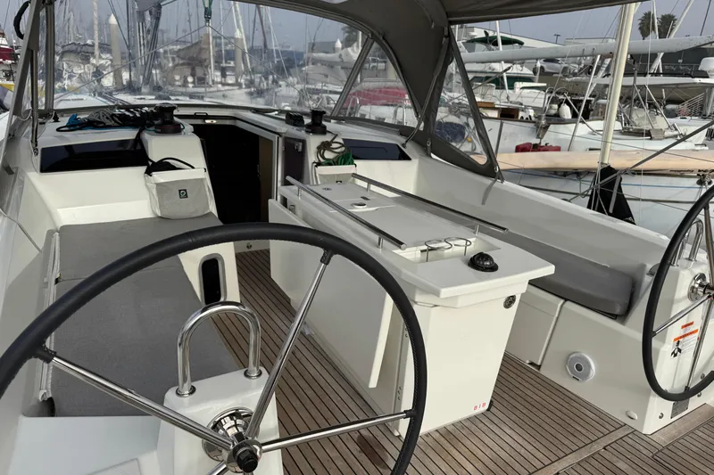 Madras Yacht Photos Pics Cockpit of 2022 Beneteau Oceanis 40.1 sailboat with dual steering wheels and teak flooring.