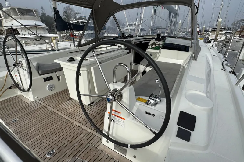 Madras Yacht Photos Pics 2022 Beneteau Oceanis 40.1 yacht cockpit with dual steering wheels and teak decking.