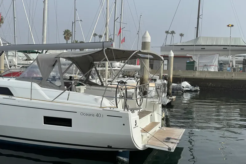 Madras Yacht Photos Pics 2022 Beneteau Oceanis 40.1 yacht docked at marina, featuring sleek design and spacious deck.
