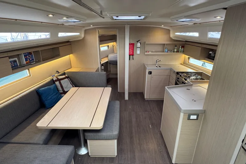 Madras Yacht Photos Pics Interior of 2022 Beneteau Oceanis 40.1 yacht, featuring modern kitchen and cozy seating area.