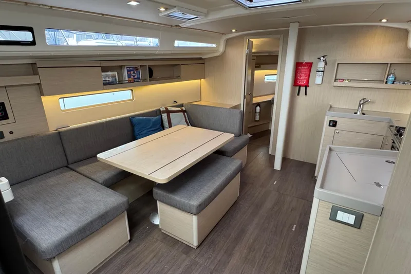 Madras Yacht Photos Pics Modern interior of 2022 Beneteau Oceanis 40.1 yacht with spacious seating and kitchen area.