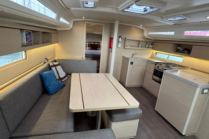 Madras Yacht Photos Pics 2022 Beneteau Oceanis 40.1 interior with modern kitchen and cozy seating area.