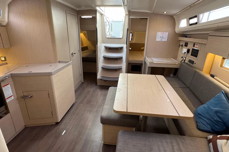 Madras Yacht Photos Pics Interior of 2022 Beneteau Oceanis 40.1 yacht, featuring modern dining area and cozy seating.