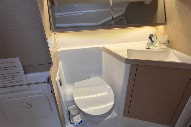Madras Yacht Photos Pics Modern bathroom in 2022 Beneteau Oceanis 40.1 yacht with toilet and sink.