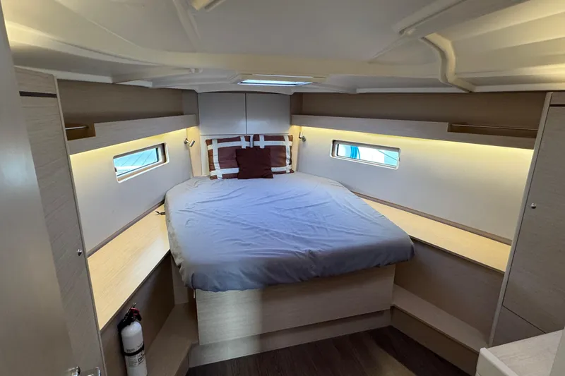 Madras Yacht Photos Pics Interior cabin of 2022 Beneteau Oceanis 40.1 yacht, featuring a cozy bed and modern design.
