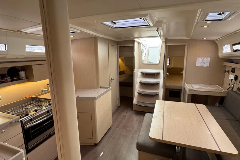 Madras Yacht Photos Pics Interior of 2022 Beneteau Oceanis 40.1 yacht, featuring modern kitchen and dining area.