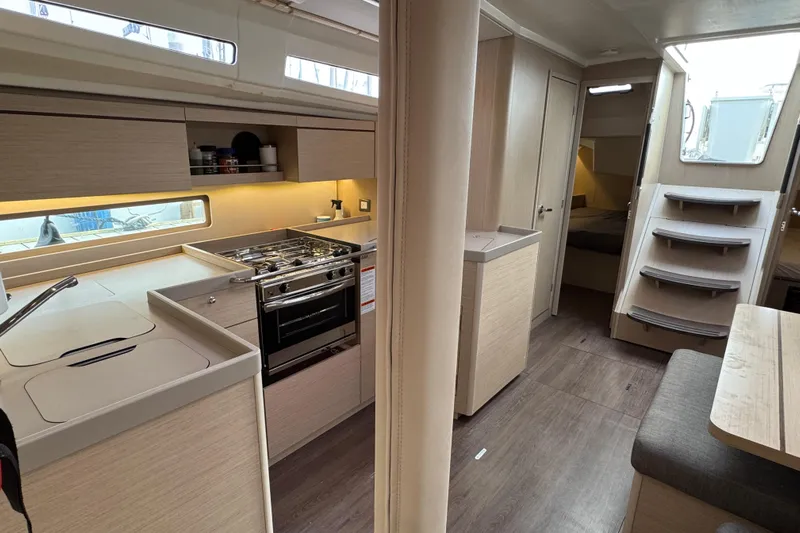 Madras Yacht Photos Pics Interior of 2022 Beneteau Oceanis 40.1 yacht, featuring modern kitchen and cozy living space.