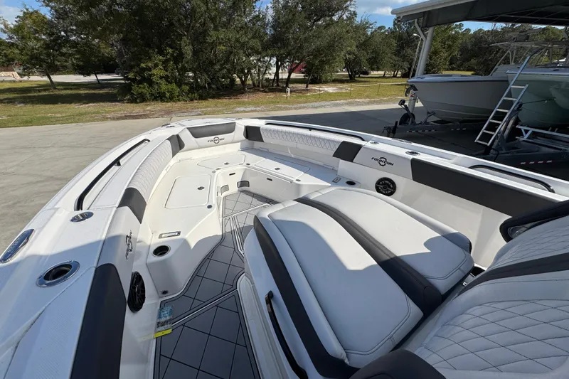  Yacht Photos Pics 2025 Fountain 32 NX boat interior with spacious seating and modern design.