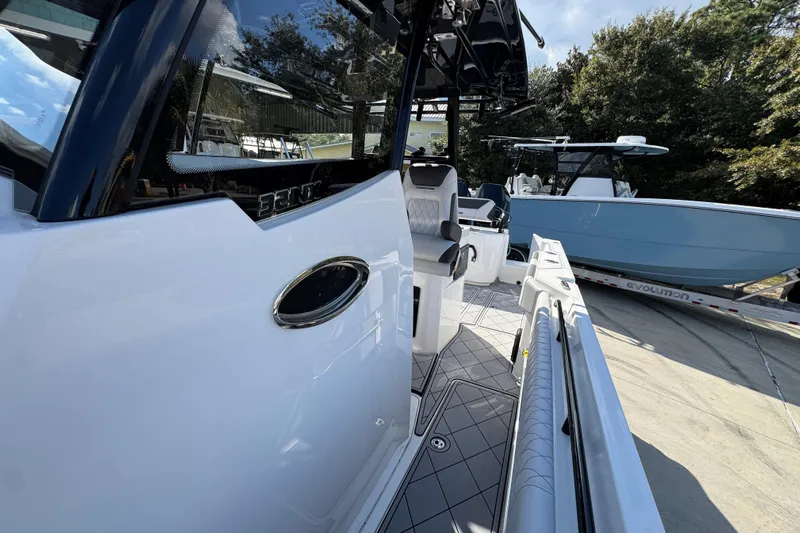  Yacht Photos Pics 2025 Fountain 32 NX boat interior with sleek design and modern seating.