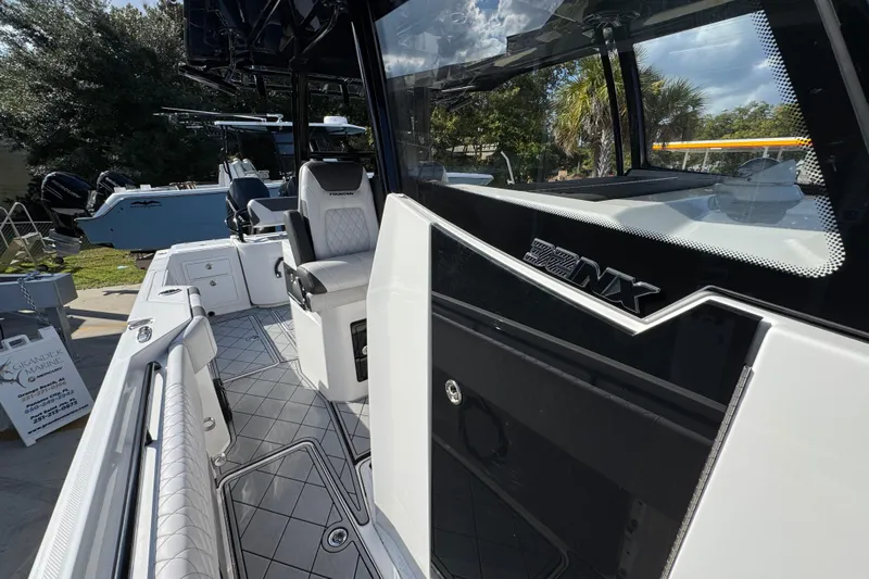  Yacht Photos Pics 2025 Fountain 32 NX boat interior with sleek seating and modern design.